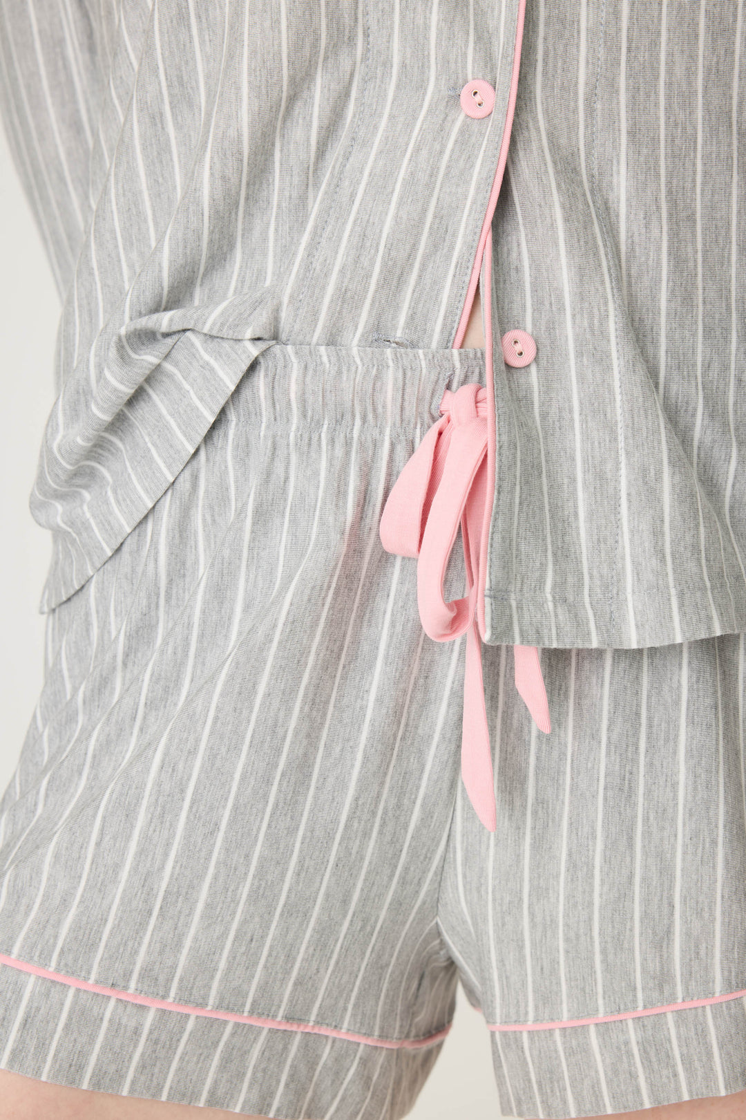 Grey-ivory pinstripe modal women's sleep short with pink piping contrast. Contrast tie waist.
