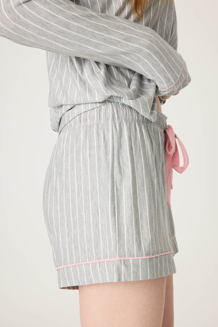 Grey-ivory pinstripe modal women's sleep short with pink piping contrast. Contrast tie waist.