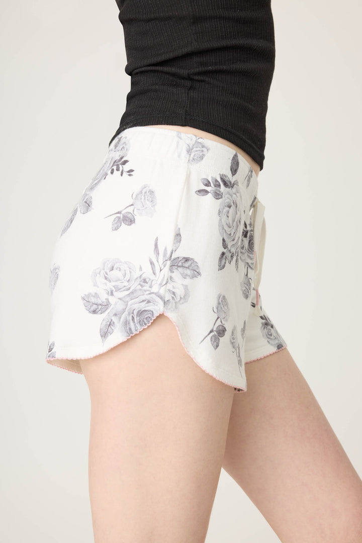 Women's white pj short with black rose pattern.