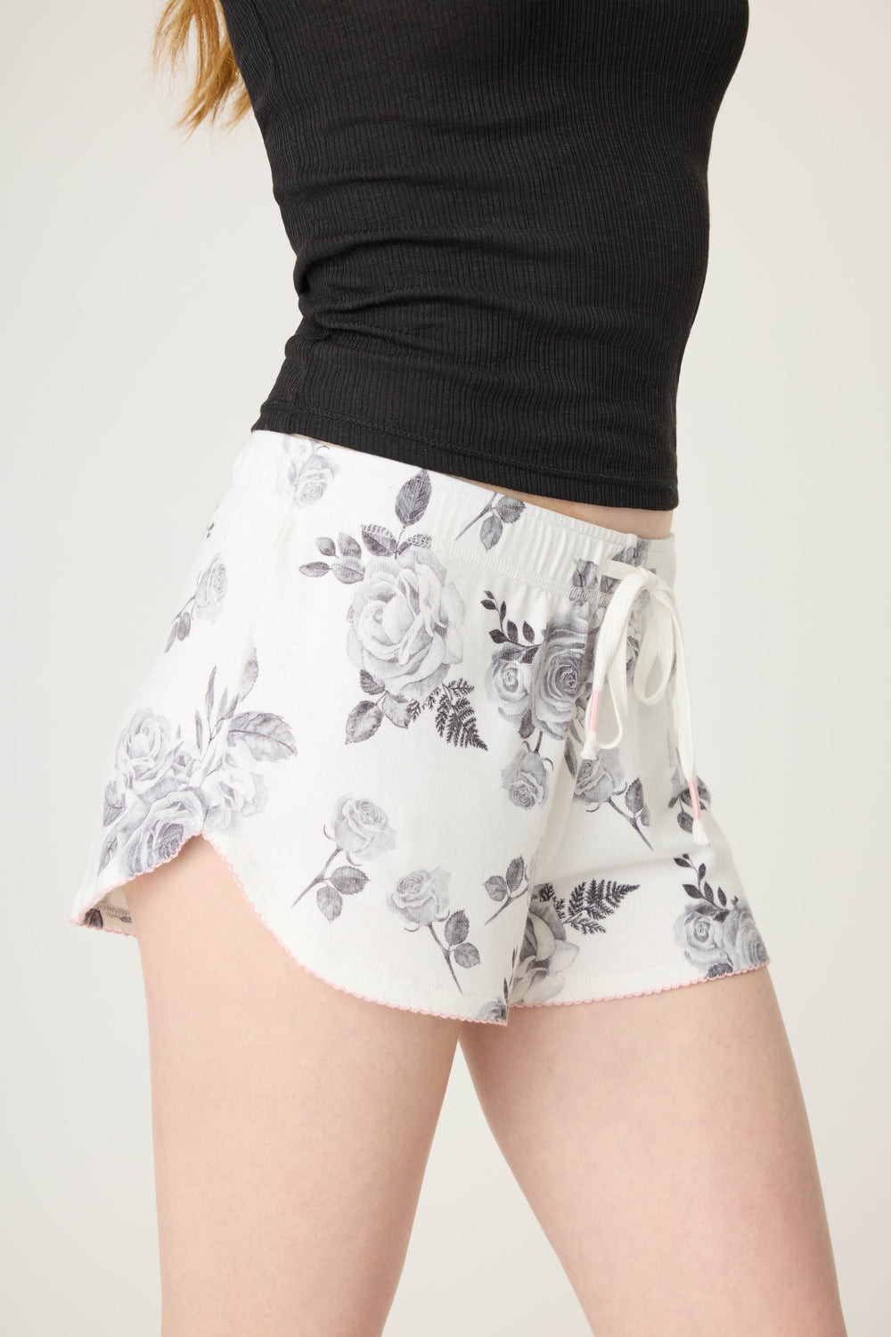 Women's white pj short with black rose pattern.