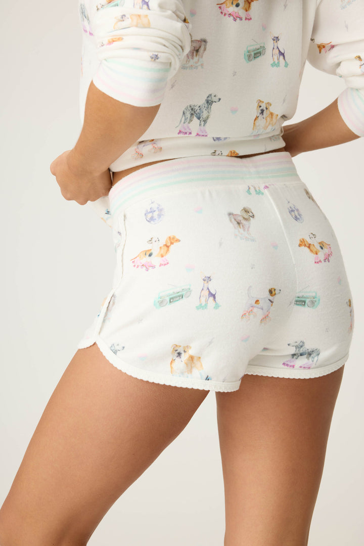 Women's ivory pajama short with dogs on rollerskates pattern. Relaxed fit with tie waist.