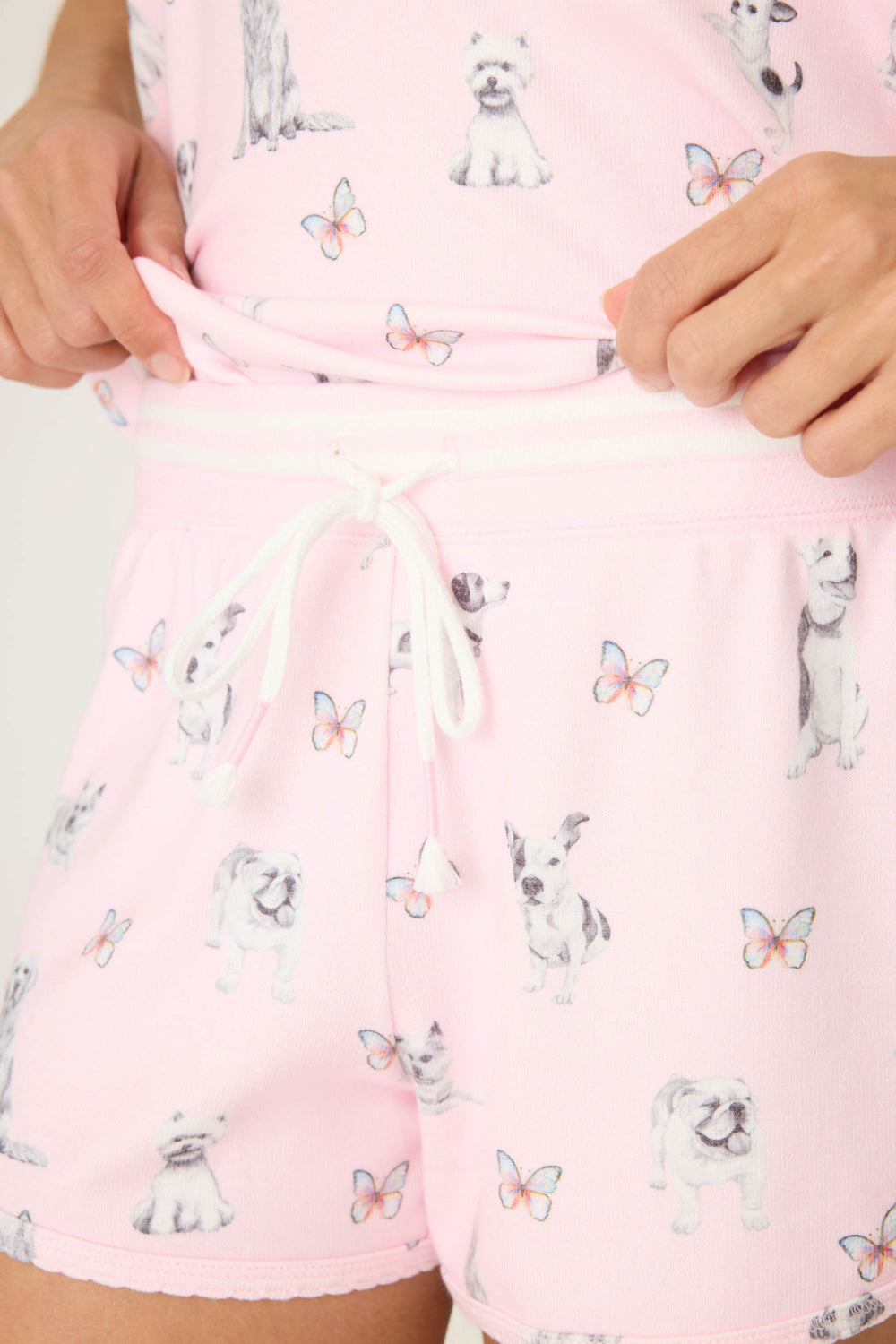 Pink dog-printed pajama short for women with tie waist & scallop trim hem.