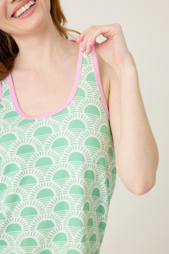 Women's green racket-sun printed racer back tank top wtih contrast binding armholes. Curved hem.