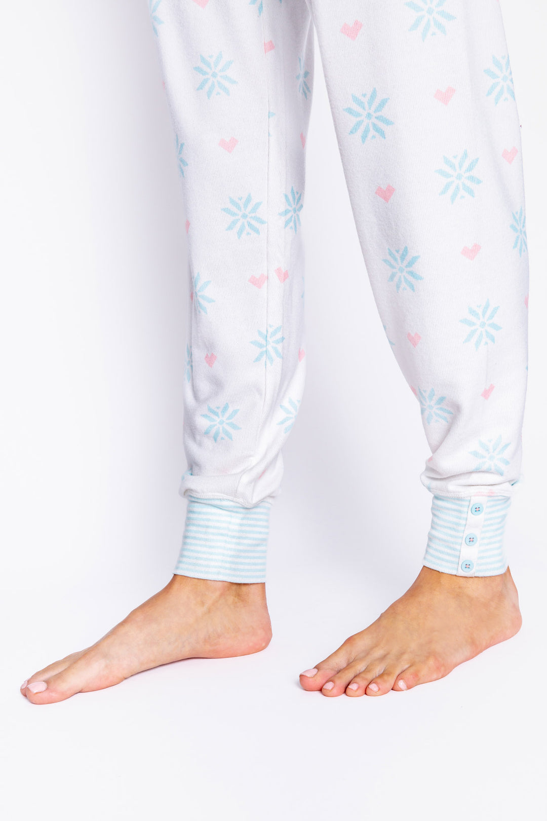 Ivory peachy jammie pant with blue & pink snowflake print. Rib cuffs with faux buttons on cuff. (6982901104740)
