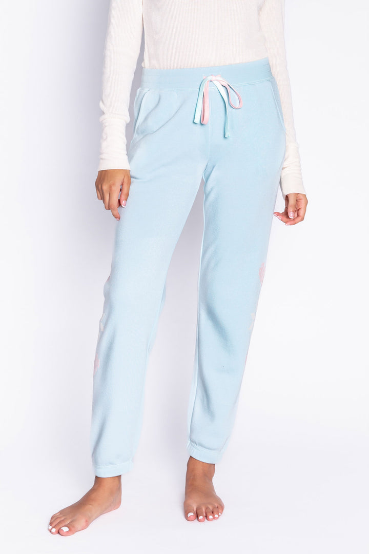 Light blue fleece jogger pant with flocked snowflake graphic print on sides. Comfy side pockets & tie waist. (6982901137508)
