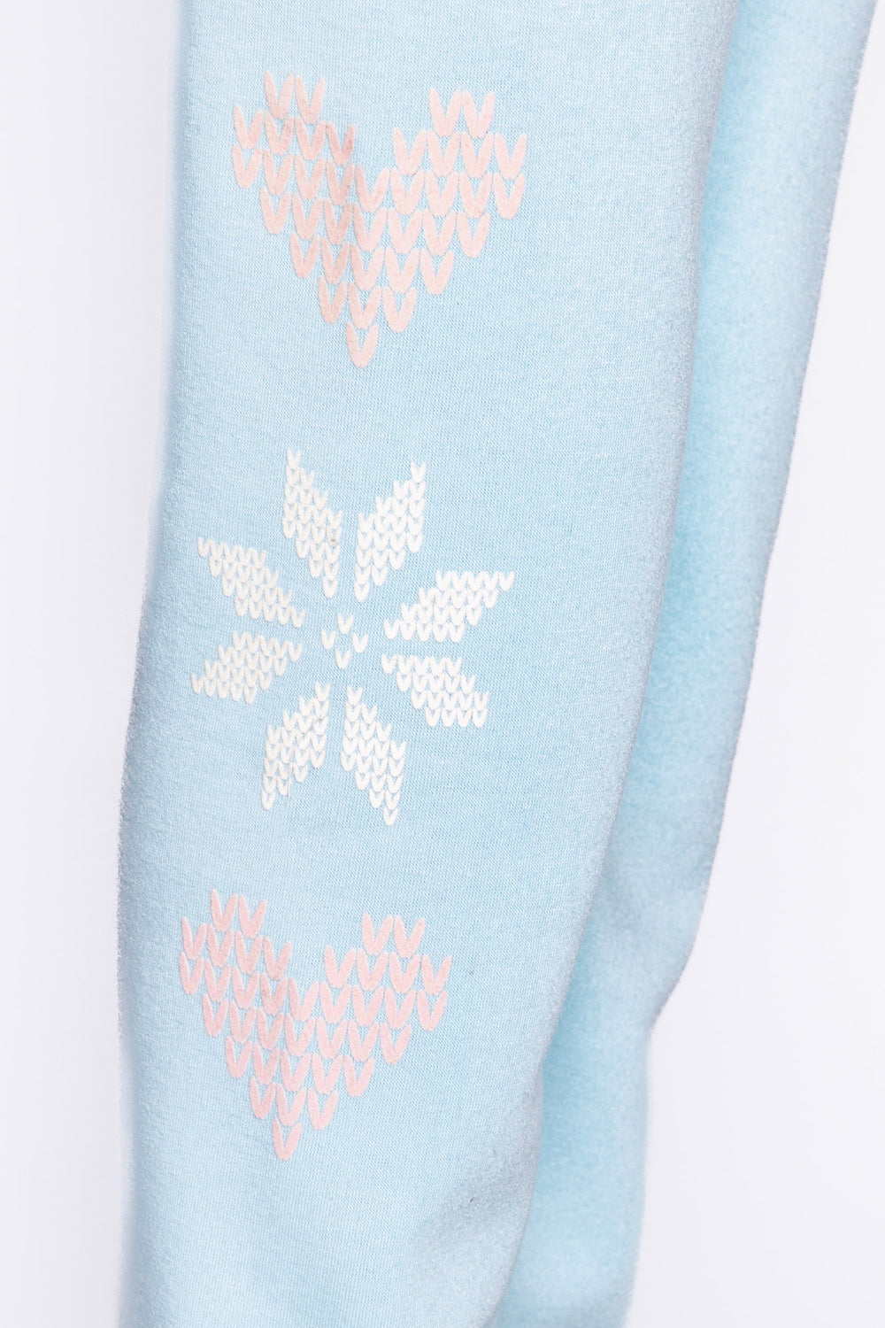 Light blue fleece jogger pant with flocked snowflake graphic print on sides. Comfy side pockets & tie waist. (6982901137508)