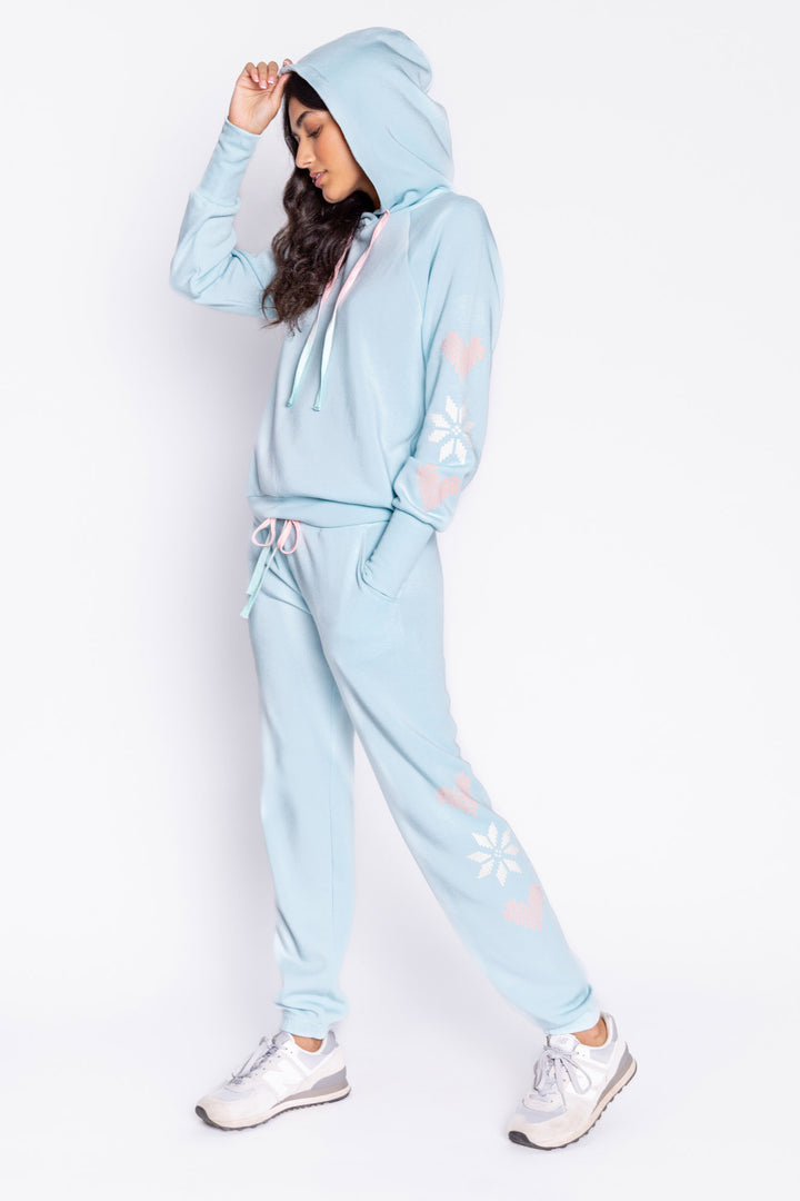 Light blue fleece jogger pant with flocked snowflake graphic print on sides. Comfy side pockets & tie waist. (6982901137508)
