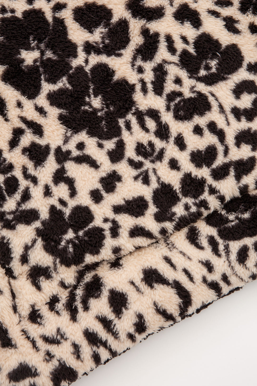 Tan-black leopard printed dog blanket is reversible to dark grey faux shearling back. Rolled in carry strap. (6889064923236)