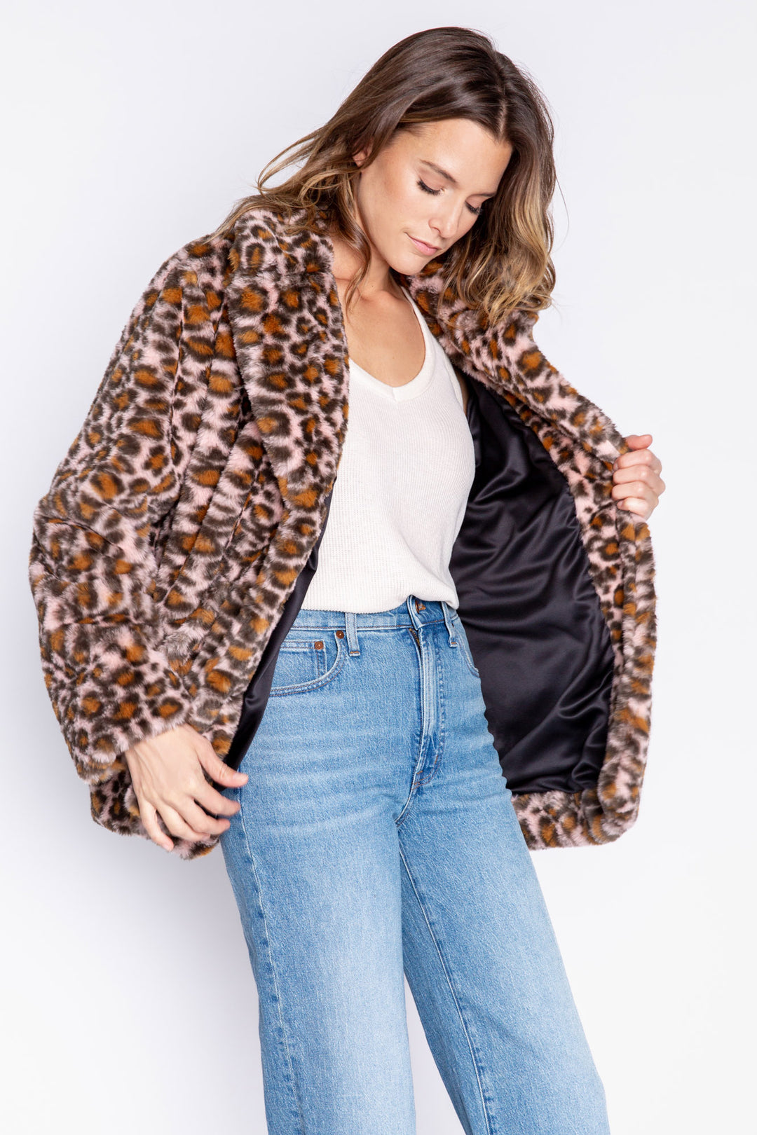 Faux fur coat in pale pink-black-brown leopard print. Fully lined with inside print. Button-front close. (6982898679908)