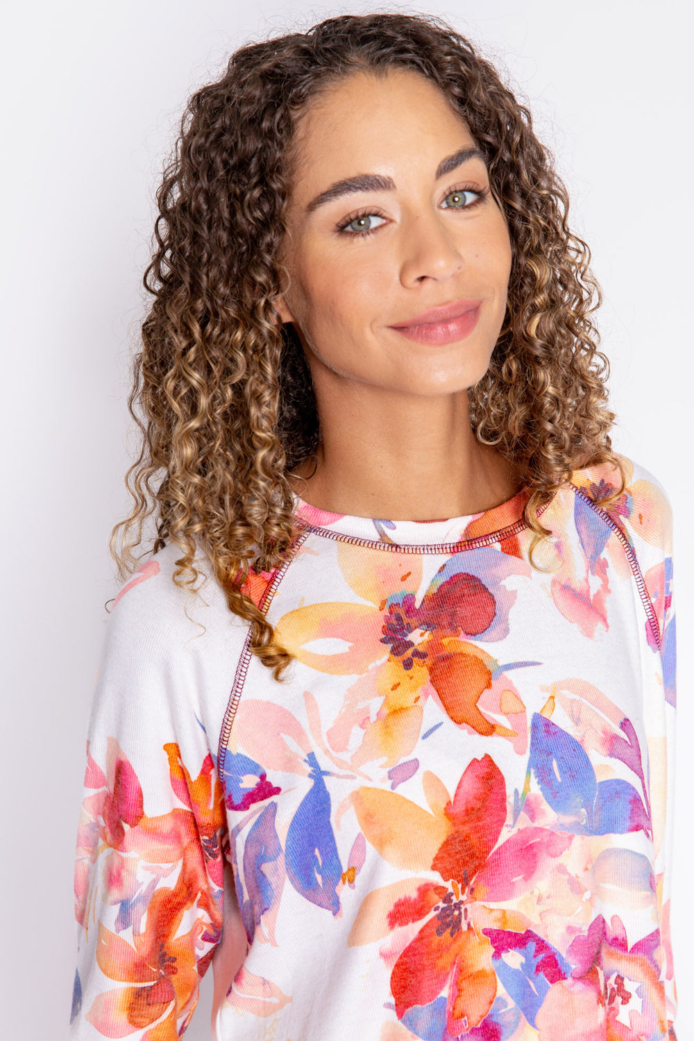 Long sleeve top with button cuffs, printed with autumn watercolor floral. Rounded hem. (6889073279076)