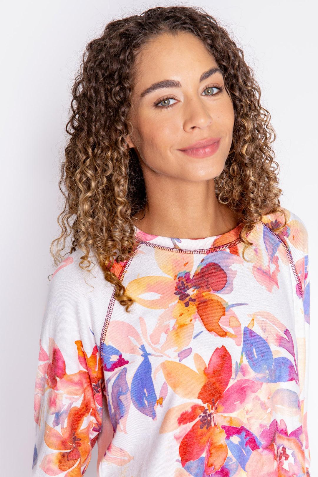 Long sleeve top with button cuffs, printed with autumn watercolor floral. Rounded hem. (6889073279076)
