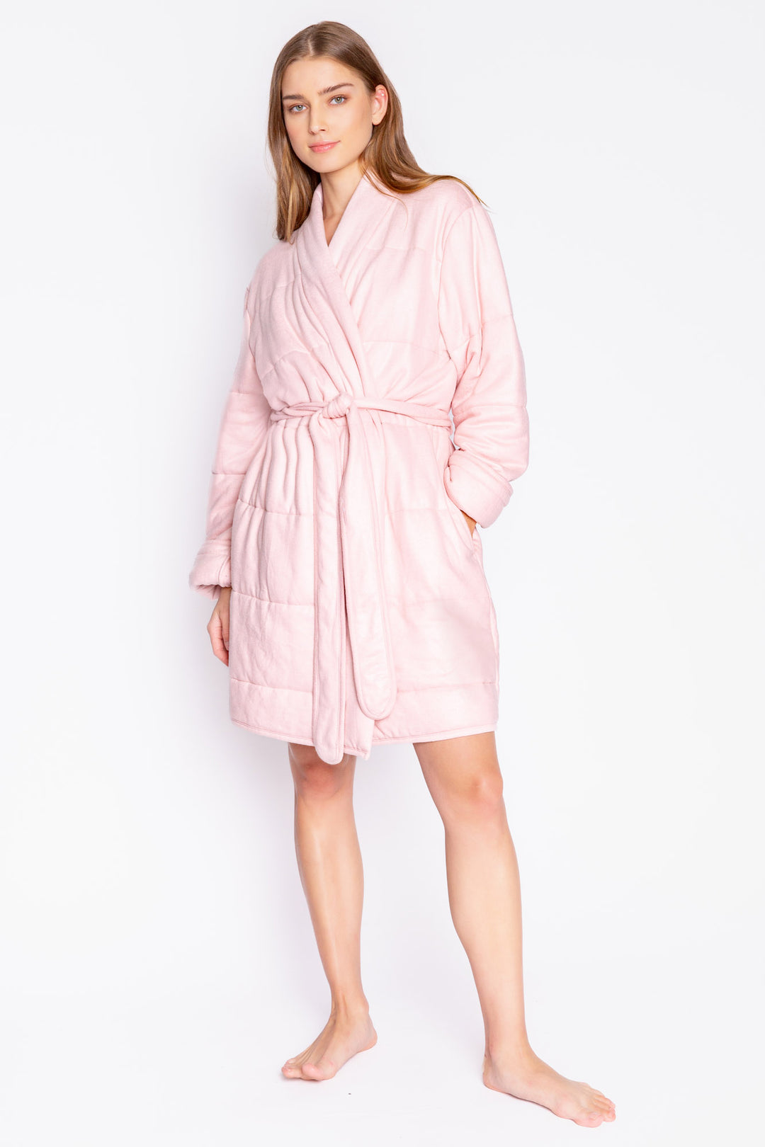 Pale pink wrap robe in horizontal quilted peachy fabric. Robe has self belt, knee length. (7068592570468)
