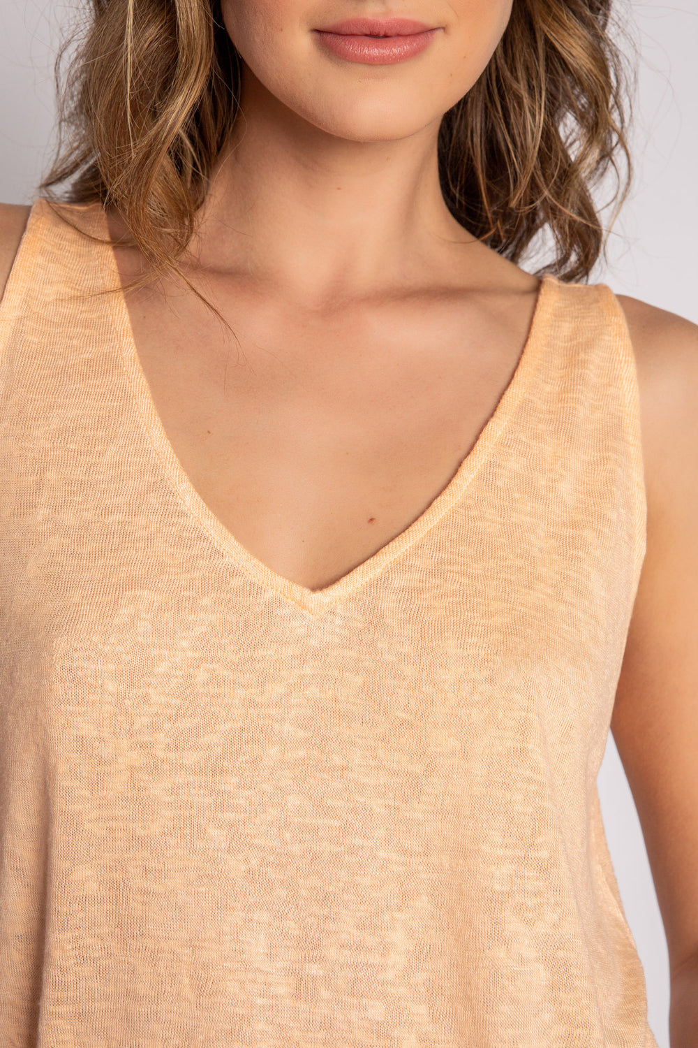 Orange flowy tank top with words to live by on the back neck taping. (7125181497444)
