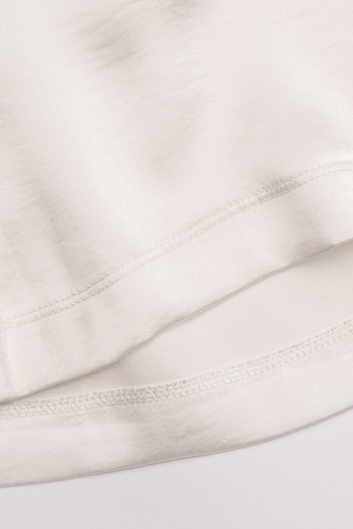 White lounge set in aloe-infused woven faux silk with short sleeve button-down top and lounge pant. (7125190934628)