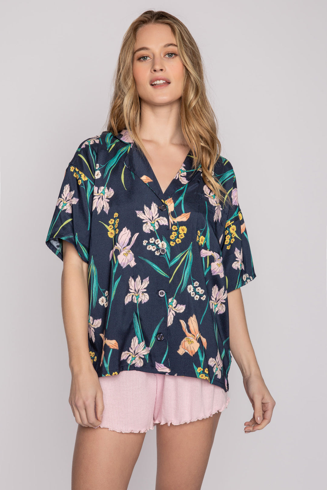 Woven navy short sleeve button-down top in floral lily print with smooth satin back. (7125192376420)