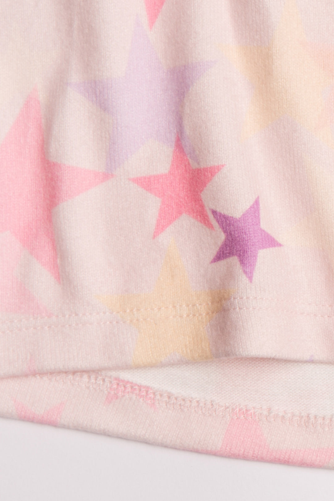 Blush pink hoody with colorful star print on peachy jersey fabric. (7125197979748)
