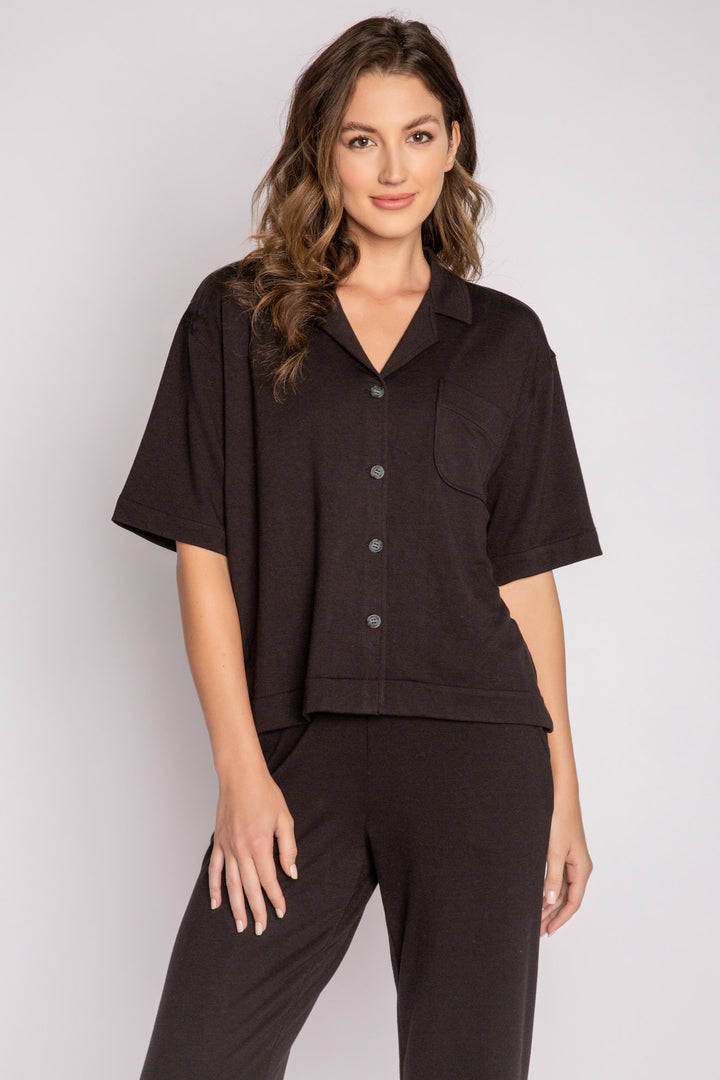 Black terry lounge set with short sleeve button-down top and tie waist pants. (7125203714148)