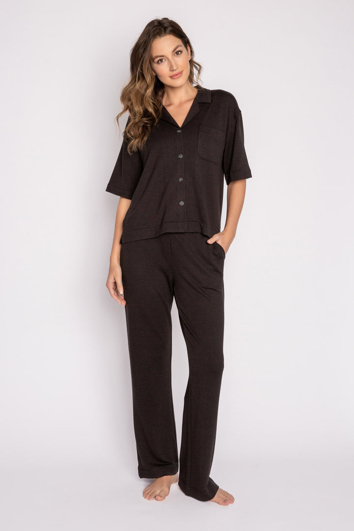 Black terry lounge set with short sleeve button-down top and tie waist pants. (7125203714148)
