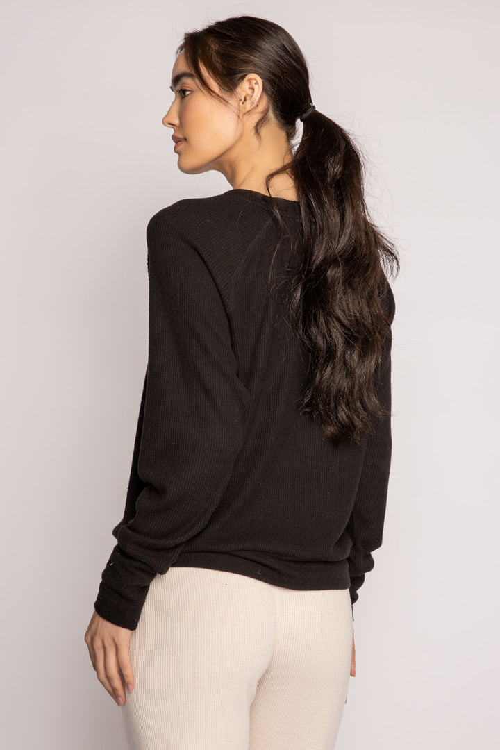 Black V-neck top with relaxed fit in 2x2 peachy rib. Banded sleeve cuff & neck rib. (7122611535972)