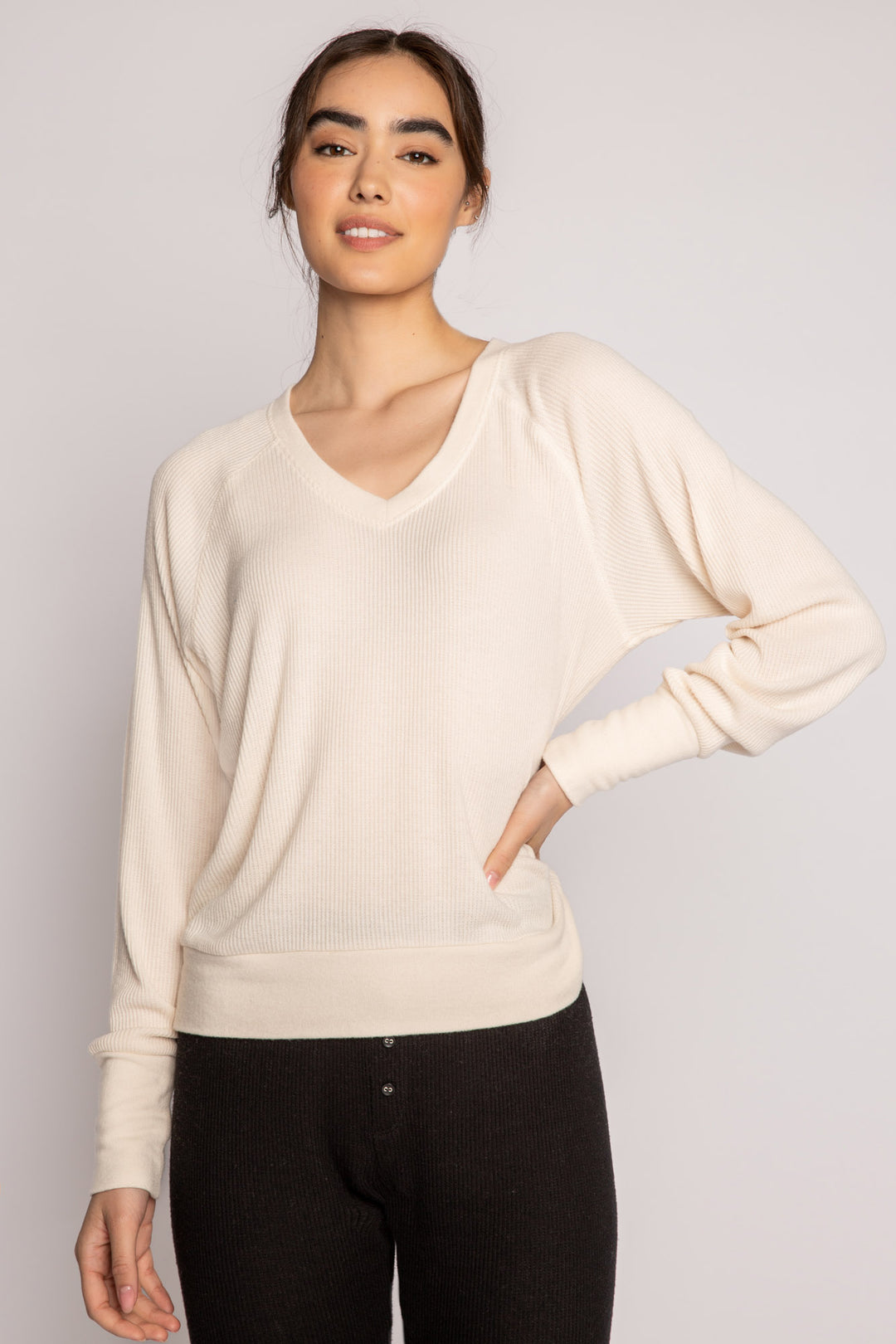 Ivory V-neck top with relaxed fit in 2x2 peachy rib. Banded sleeve cuff & neck rib. (7122611667044)