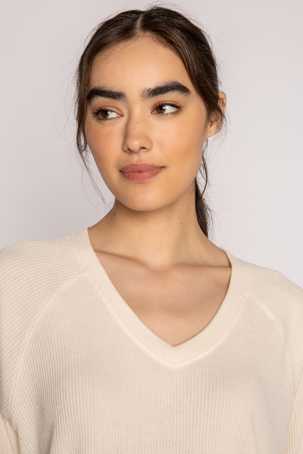 Ivory V-neck top with relaxed fit in 2x2 peachy rib. Banded sleeve cuff & neck rib. (7122611667044)