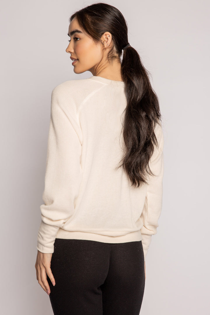 Ivory V-neck top with relaxed fit in 2x2 peachy rib. Banded sleeve cuff & neck rib. (7122611667044)