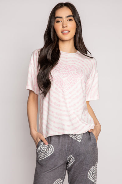 Ivory t-shirt in peachy knit with heart-patterned tie-dye in pink. Boxy, relaxed fit, open hem. (7215133818980)