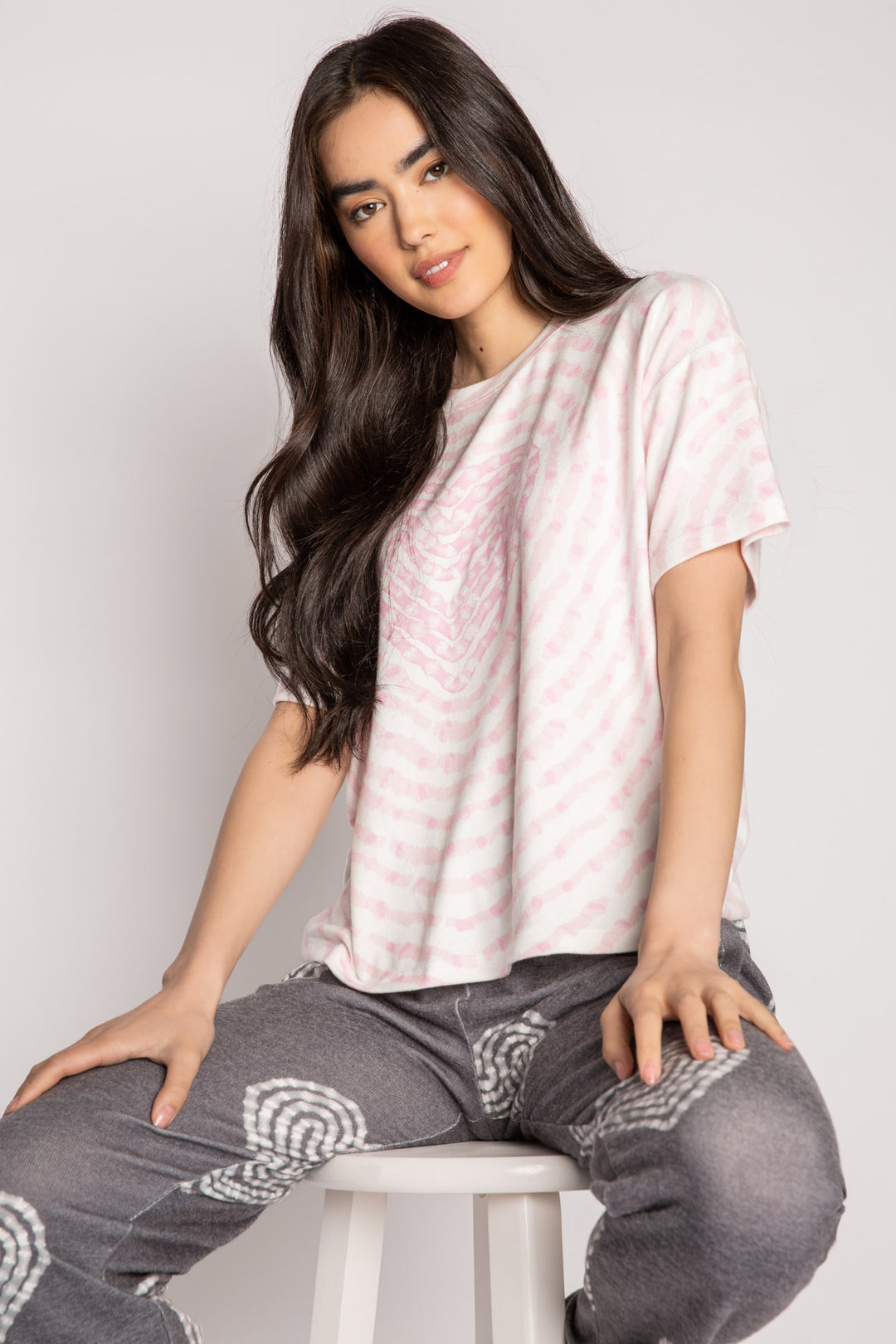 Ivory t-shirt in peachy knit with heart-patterned tie-dye in pink. Boxy, relaxed fit, open hem. (7215133818980)
