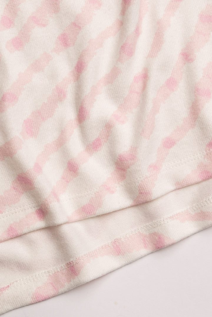 Ivory t-shirt in peachy knit with heart-patterned tie-dye in pink. Boxy, relaxed fit, open hem. (7215133818980)