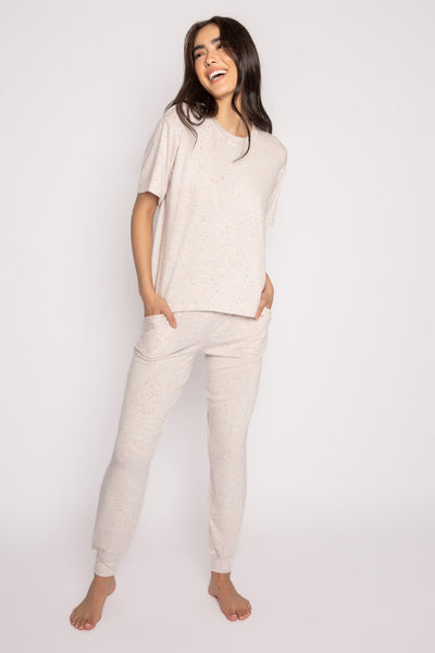Ivory lounge set in a multi confetti-flecked knit. Half-sleeve top & banded pant with pockets. (7231864930404)