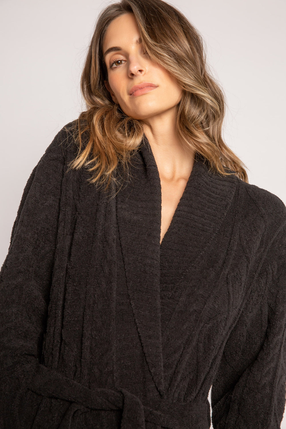Cable-embossed plush robe in black cable with thick ribbed collar & tie. Front patch pockets & rib belted tie. (7231865028708)