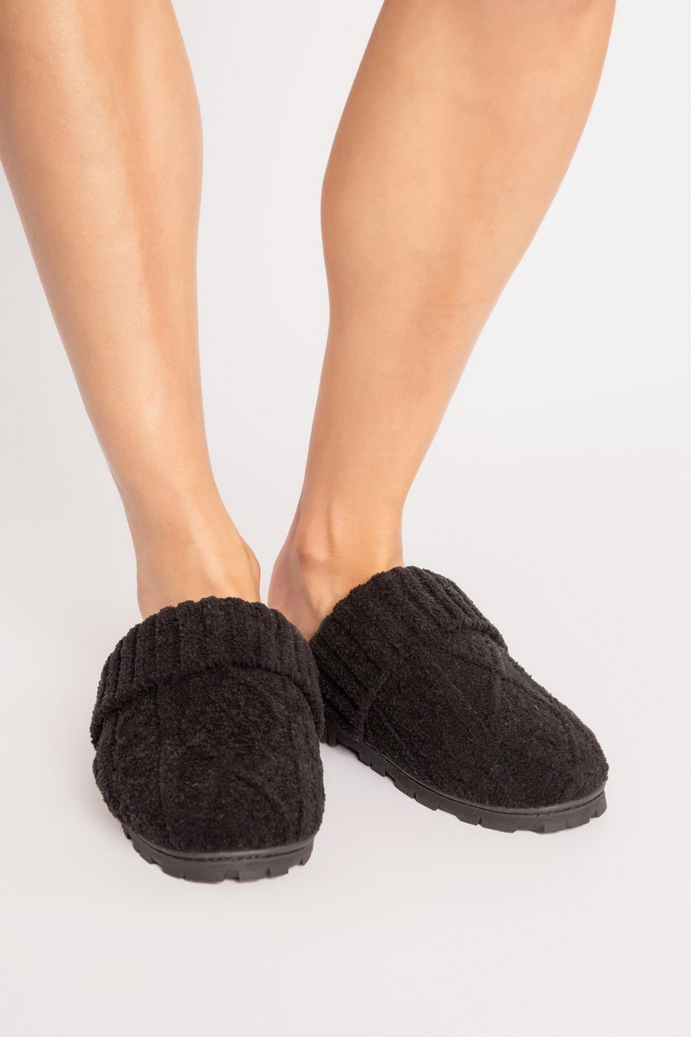 Cable-embossed slipper in black with ribbed trim & curly faux fur footbed lining. Rubber outsole. (7231865192548)