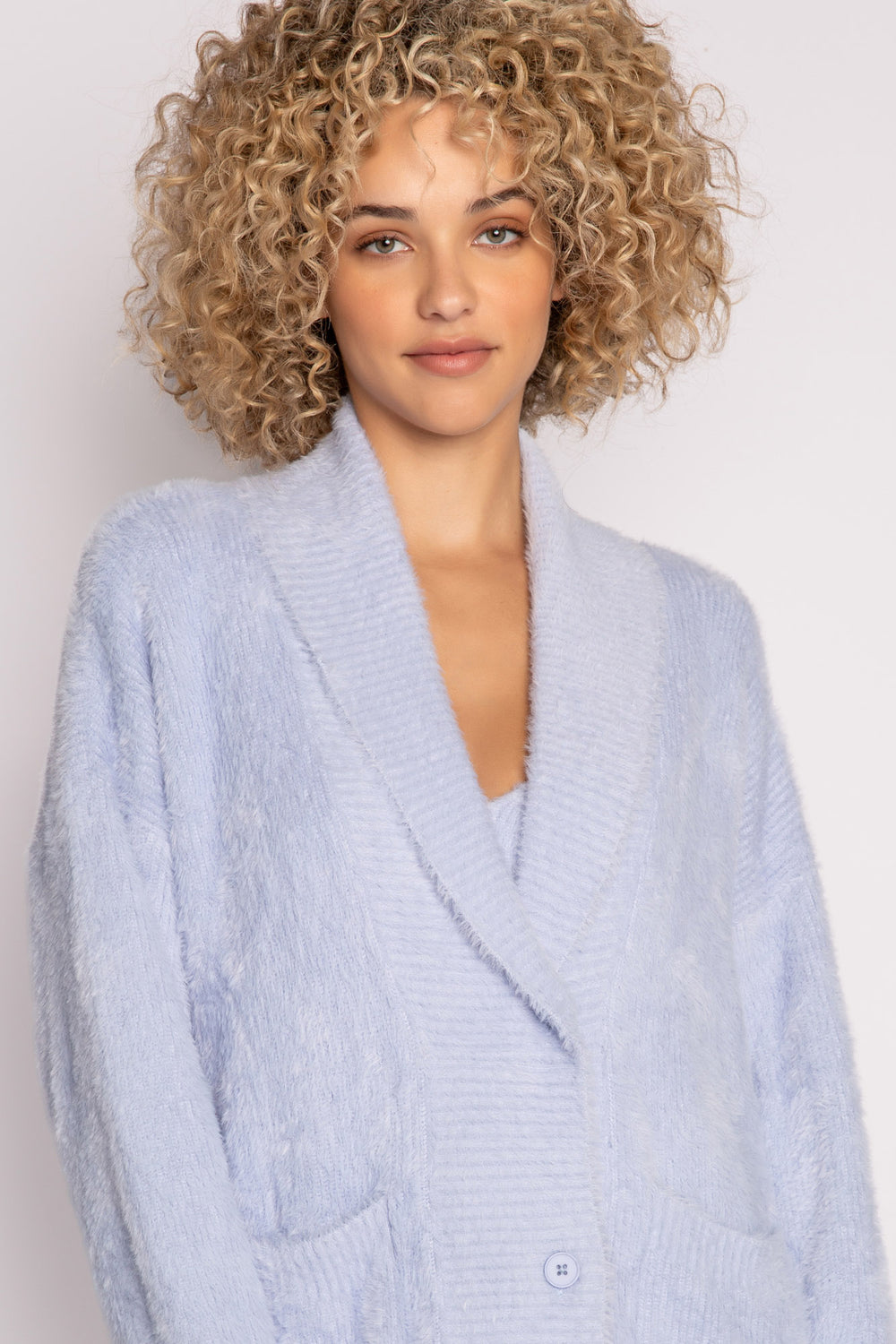 Light blue sweater-knit cardigan sweater with front patch pockets. 3-button front. (7231867650148)