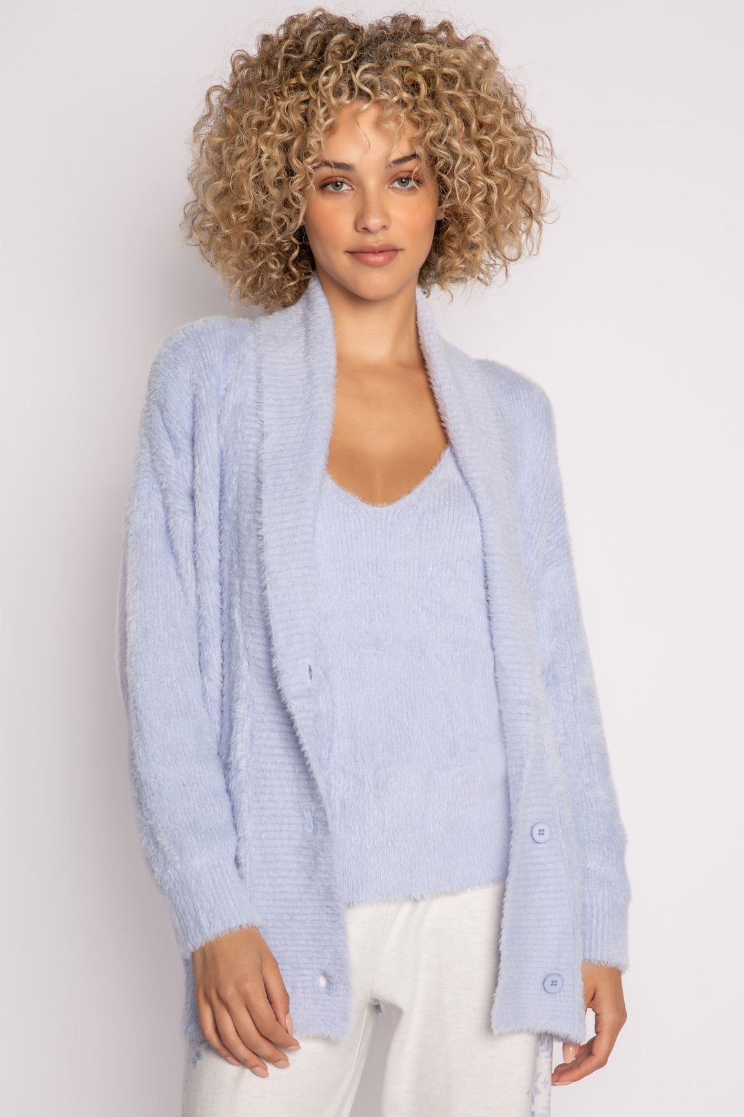Light blue sweater-knit cardigan sweater with front patch pockets. 3-button front. (7231867650148)