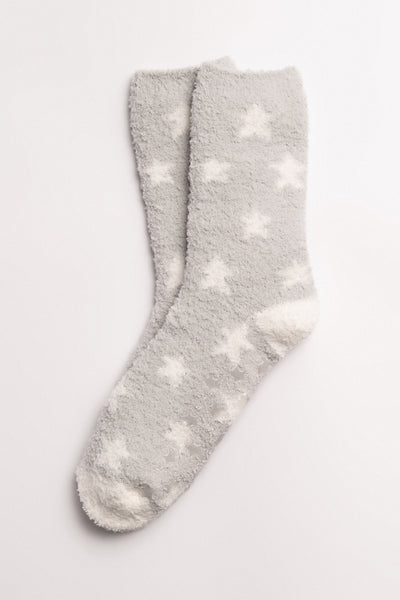 Pale grey cozy plush socks with knitted stars design. Clear-printed grippers on soles. (7231871484004)