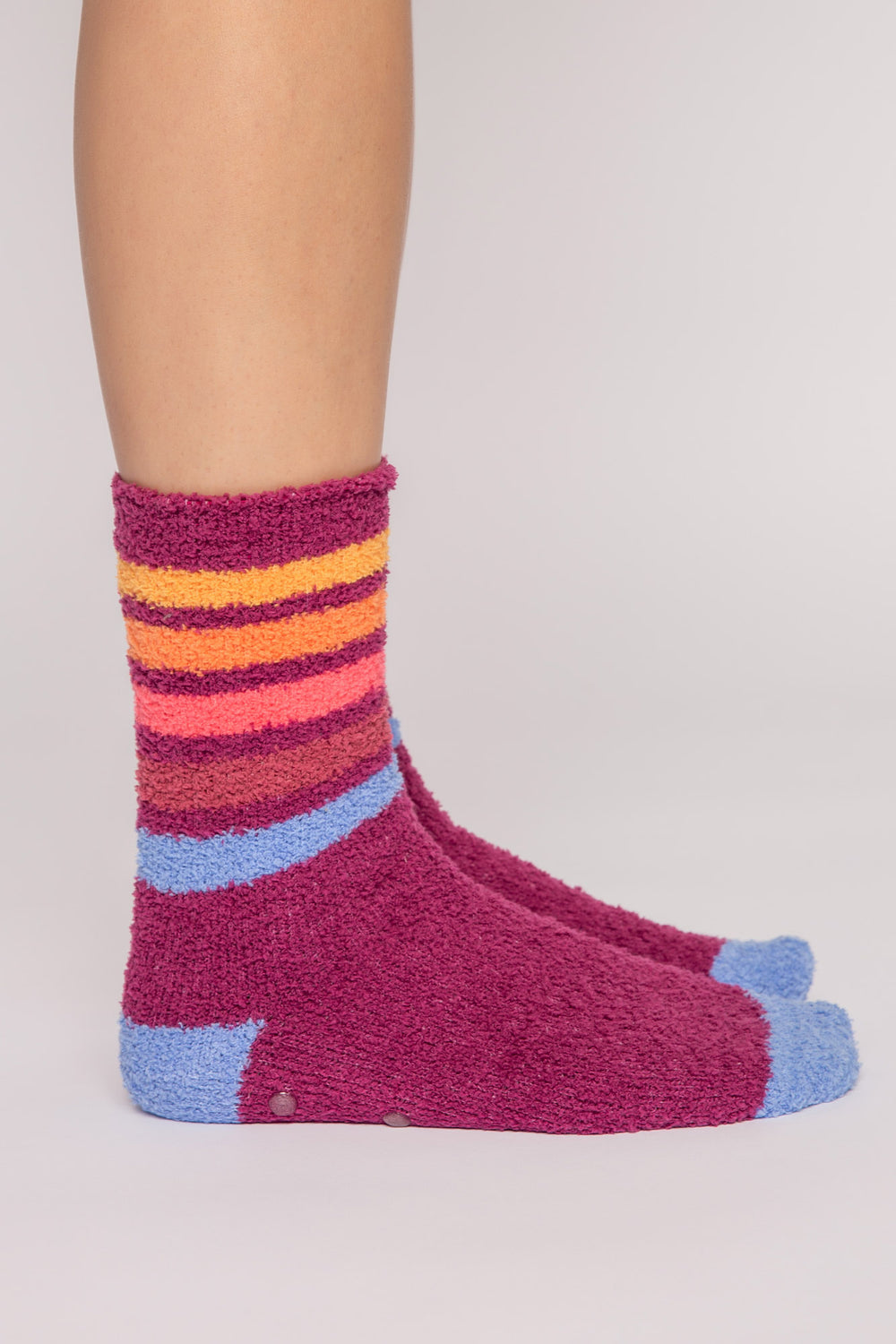 Raspberry cozy plush socks with multi-color stripes. Clear-printed grippers on soles. (7231871385700)
