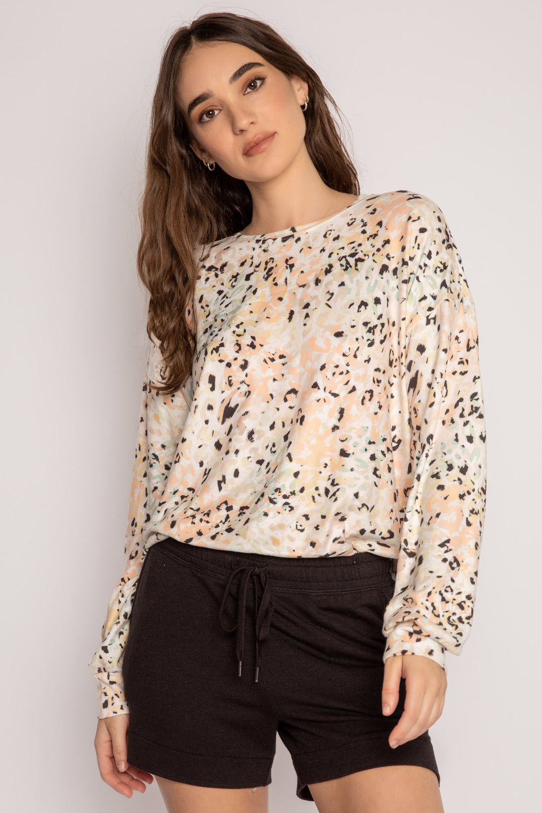 Long sleeve top in coral-ivory-black leopard print. Butter jersey knit pj top with banded hem. (7196190146660)