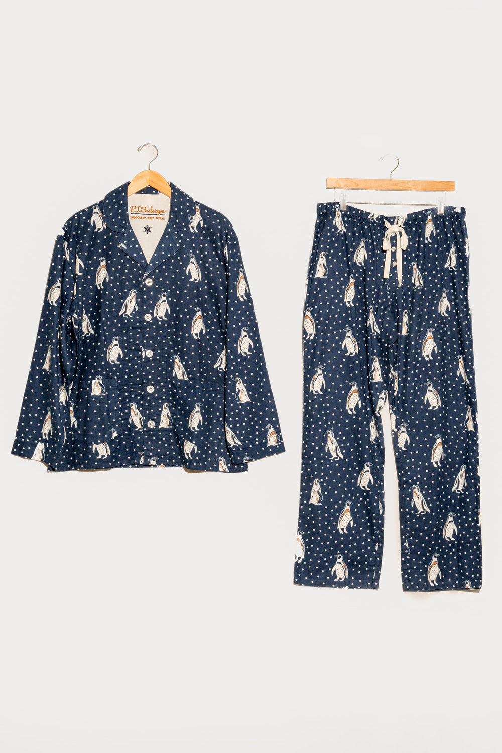 Men's navy cotton flannel pajama set button top & tie-pant with penguin print. (7231876923492)