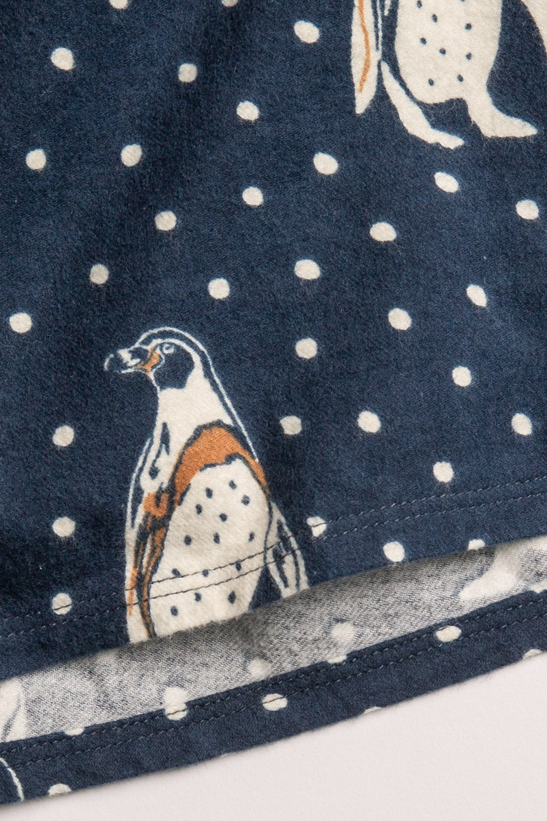 Men's navy cotton flannel pajama set button top & tie-pant with penguin print. (7231876923492)