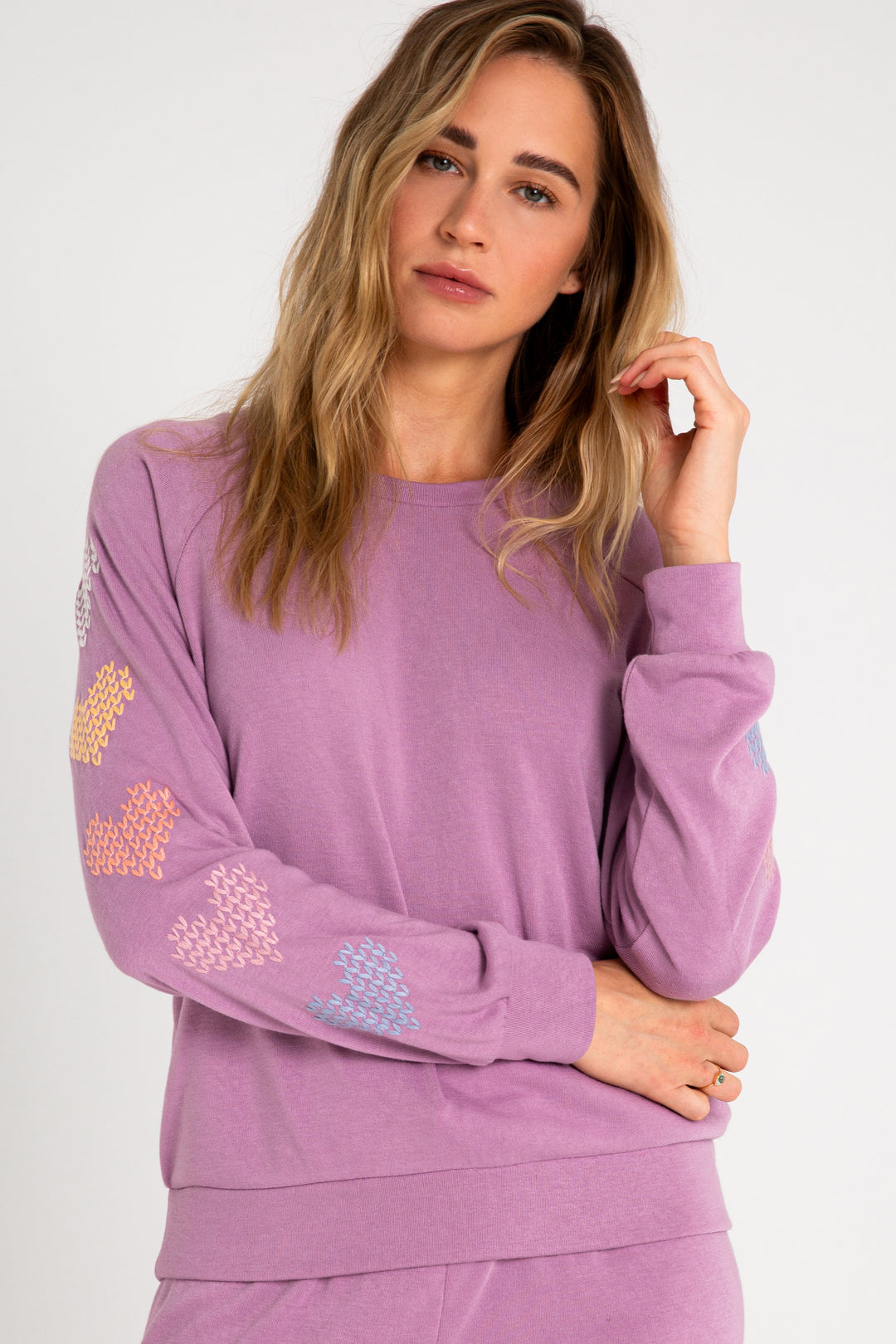 Fleece pullover top in mauve with multi-color heart printed on sleeves. (7231877677156)
