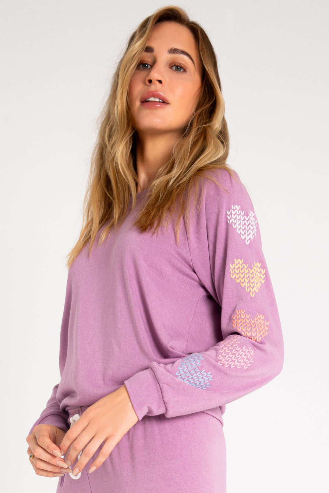 Fleece pullover top in mauve with multi-color heart printed on sleeves. (7231877677156)