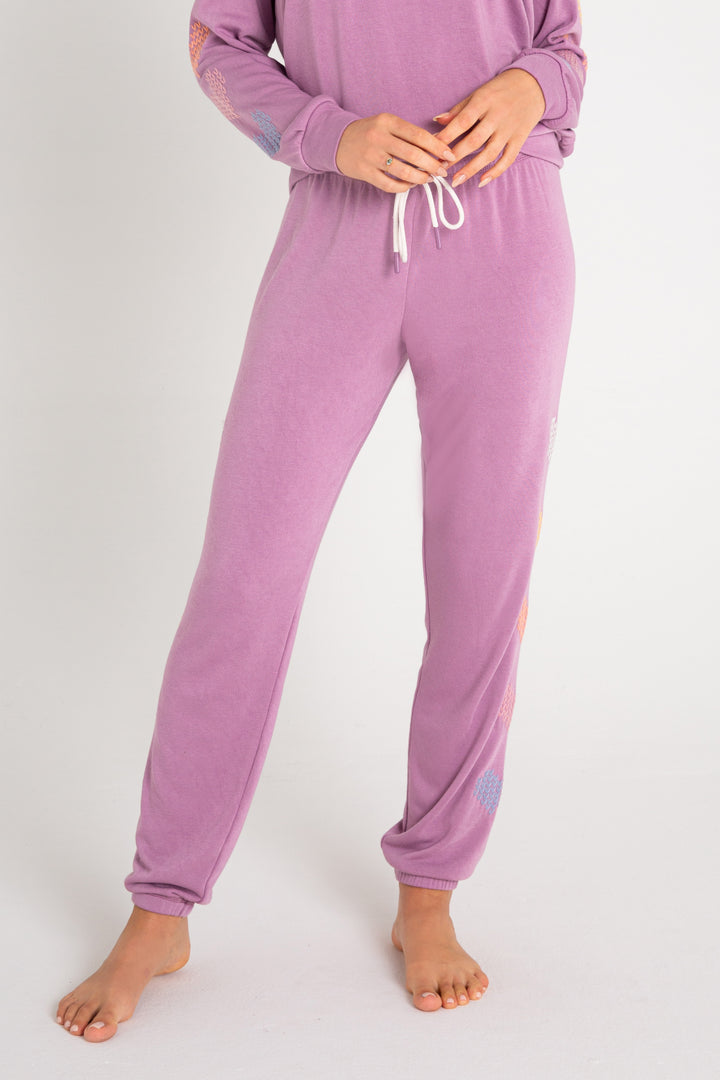 Fleece jogger in mauve with multi-color heart printed on sides. (7231878266980)