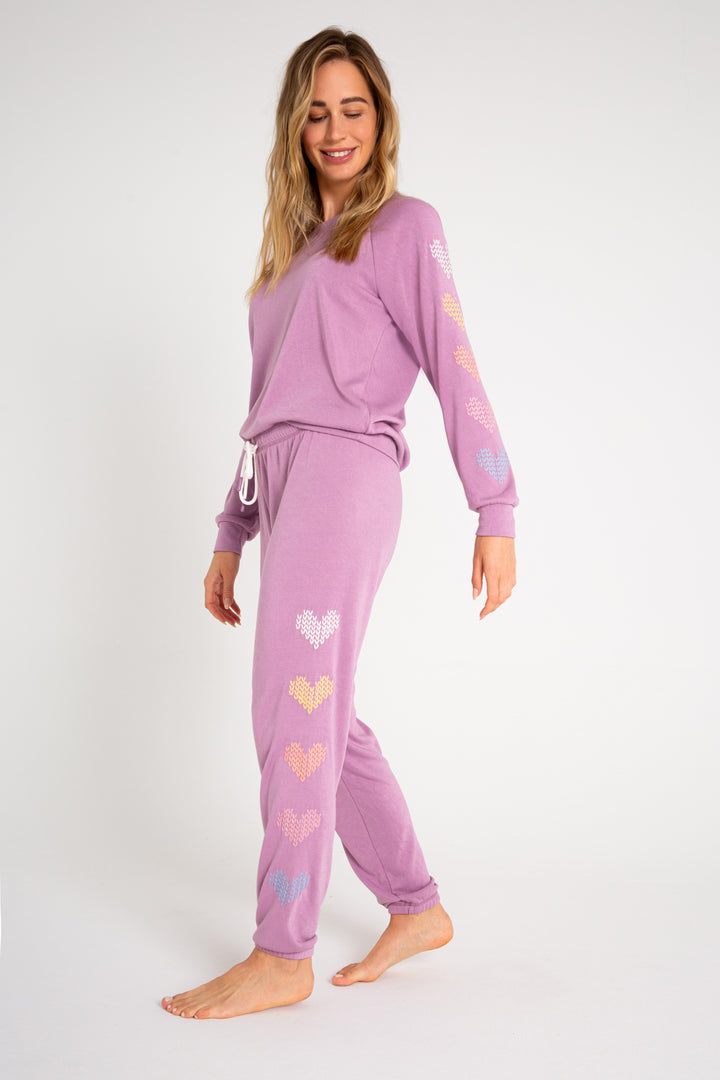 Fleece jogger in mauve with multi-color heart printed on sides. (7231878266980)
