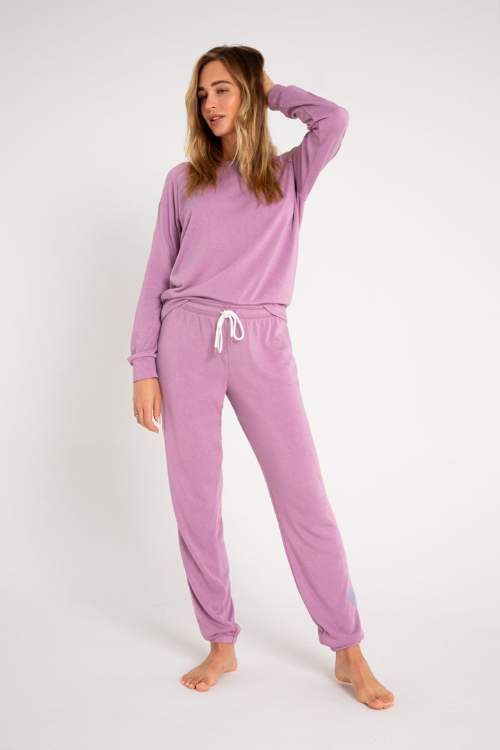 Fleece jogger in mauve with multi-color heart printed on sides. (7231878266980)