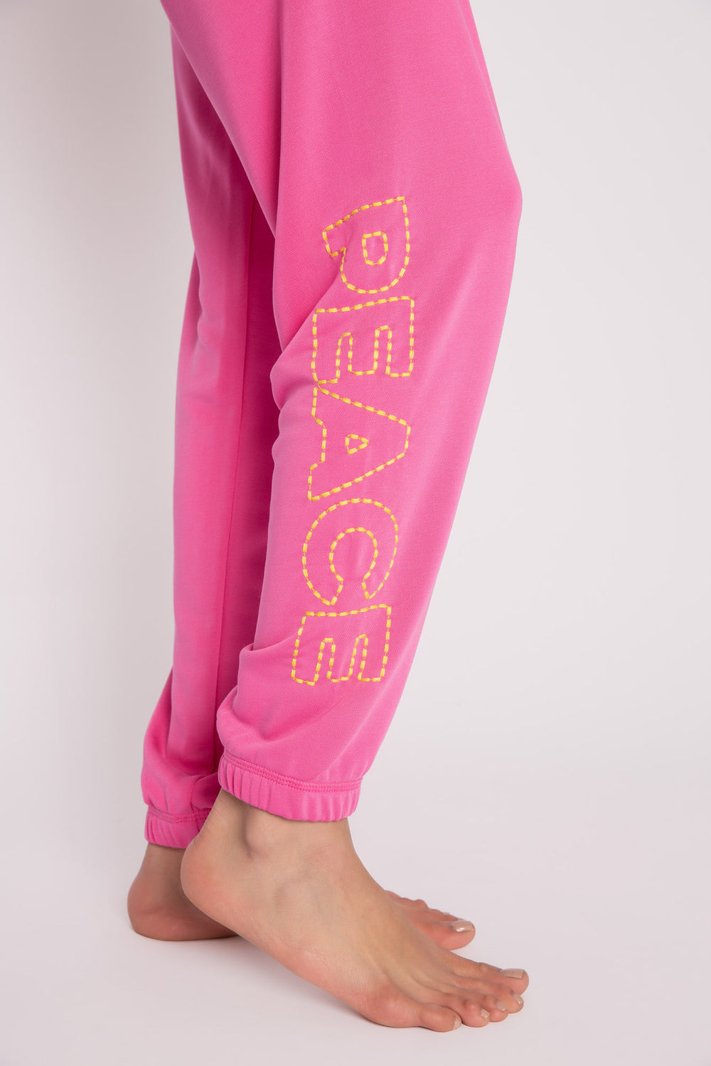 Hot pink jogger in modal French terry with neon color peace & symbol embroideries on hip/leg. (7231880003684)
