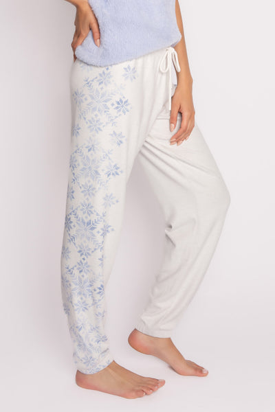 Banded pj pant in ivory with blue snowflake pattern on sides. Tie waist. (7231880495204)