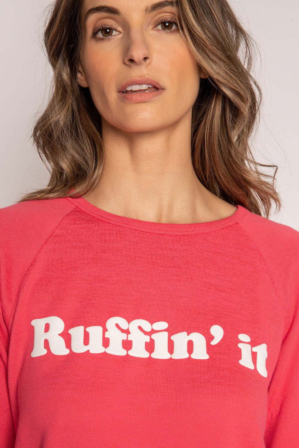 Red long sleeve top in brushed knit with white printed puff lettering on front. (7215772991588)
