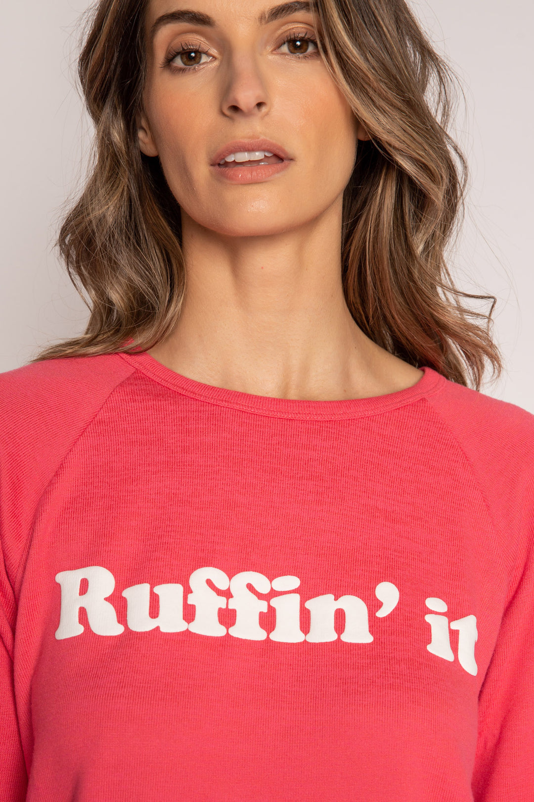 Red long sleeve top in brushed knit with white printed puff lettering on front. (7215772991588)