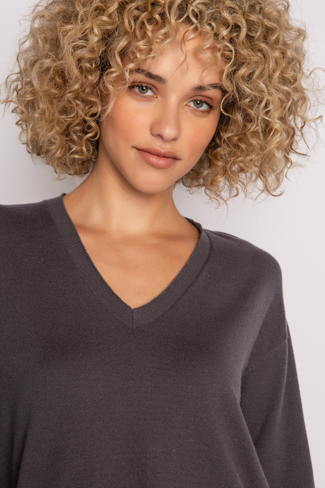 Sweater-knit V-neck sweater in charcoal with open high-low hem. (7231885803620)