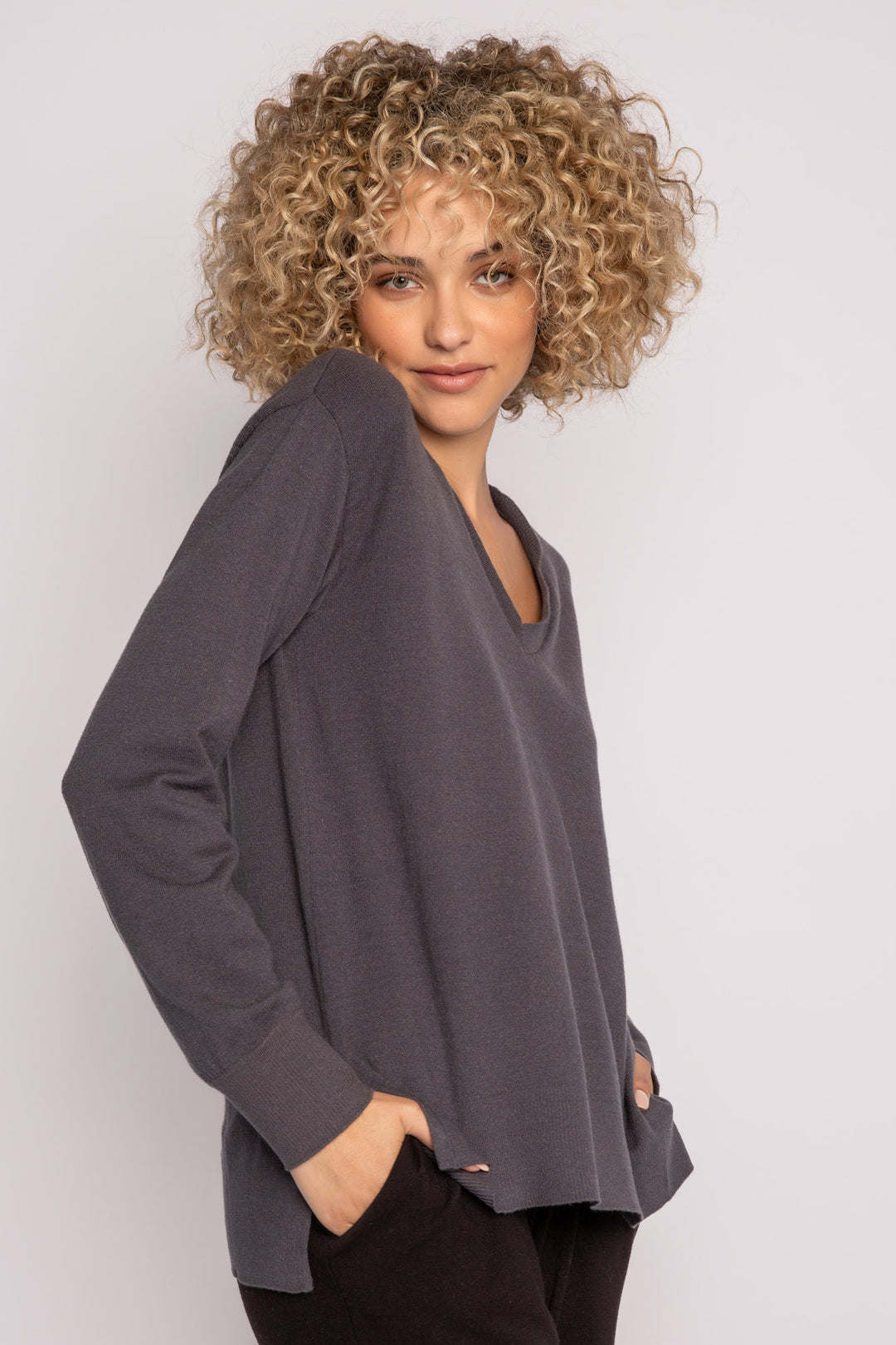 Sweater-knit V-neck sweater in charcoal with open high-low hem. (7231885803620)